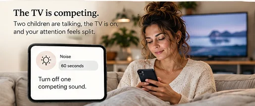 Mother on the sofa choosing the Noise reset on her phone while the TV is on.